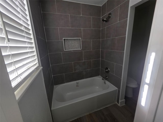 121 Tanglewood St, Baytown, TX 77520 - full bath featuring wood finished floors and washtub / shower combination