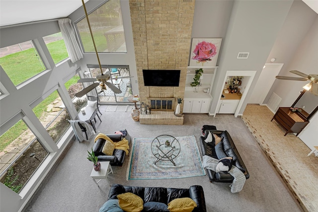 202 Old Bridge Lk, Houston, TX 77069 - living area featuring ceiling fan, a towering ceiling, carpet, and a fireplace