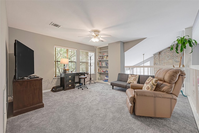 202 Old Bridge Lk, Houston, TX 77069 - carpeted living room with a ceiling fan, an office area, and built in features