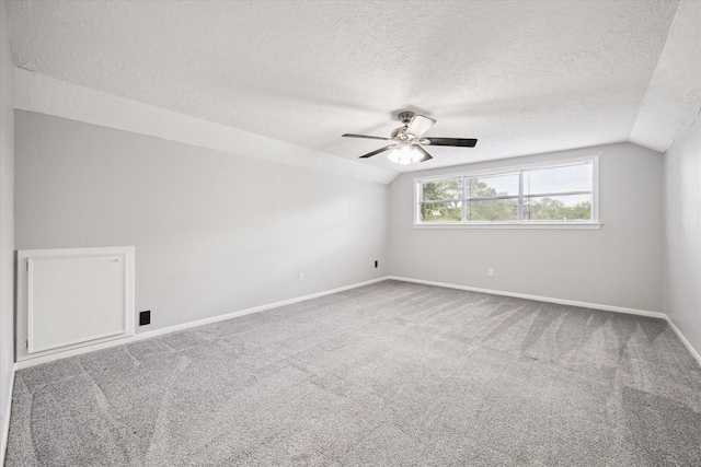 1804 Sleepy Creek Way, Pearland, TX 77581 - spare room with vaulted ceiling, a textured ceiling, ceiling fan, and carpet flooring