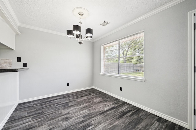 1804 Sleepy Creek Way, Pearland, TX 77581 - unfurnished dining area featuring a chandelier, a textured ceiling, dark wood finished floors, and crown molding