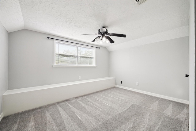 1804 Sleepy Creek Way, Pearland, TX 77581 - spare room featuring vaulted ceiling, a textured ceiling, a ceiling fan, and carpet