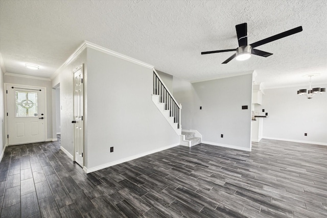 1804 Sleepy Creek Way, Pearland, TX 77581 - unfurnished living room with dark wood-type flooring, a textured ceiling, a ceiling fan, ornamental molding, and a chandelier
