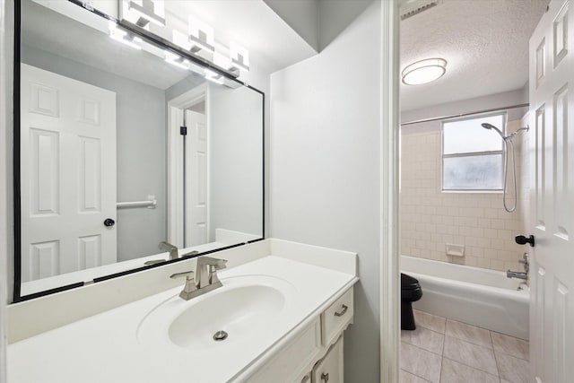 1804 Sleepy Creek Way, Pearland, TX 77581 - bathroom featuring vanity, shower / bath combination, tile patterned flooring, and a textured ceiling