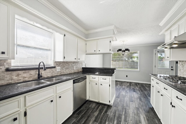 1804 Sleepy Creek Way, Pearland, TX 77581 - kitchen featuring appliances with stainless steel finishes, dark countertops, a textured ceiling, white cabinets, and decorative backsplash