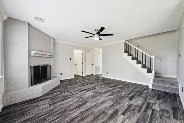 1804 Sleepy Creek Way, Pearland, TX 77581 - unfurnished living room with dark wood-style floors, ceiling fan, a brick fireplace, stairs, and crown molding