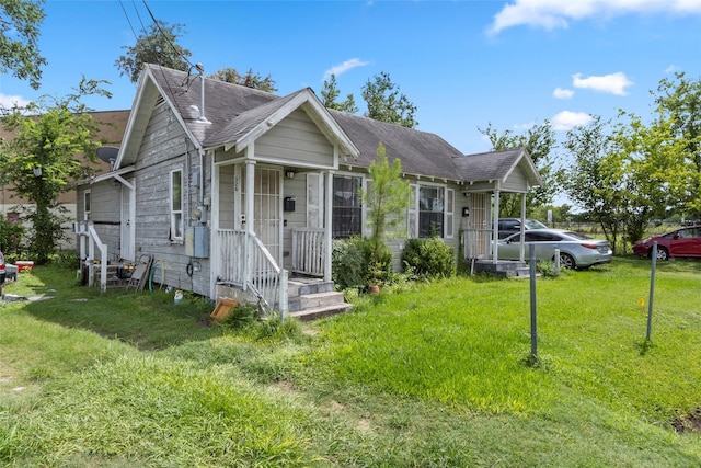 324 Erin, Houston, TX 77009 - view of front of home featuring a front yard and roof with shingles
