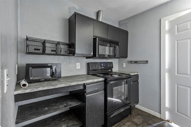 324 Erin, Houston, TX 77009 - kitchen with black appliances, gray cabinets, and light countertops