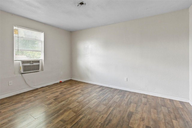 324 Erin, Houston, TX 77009 - empty room with wood finished floors and cooling unit
