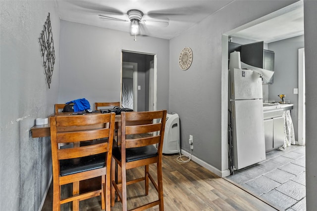 324 Erin, Houston, TX 77009 - dining space featuring ceiling fan and light wood finished floors