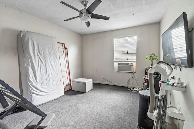 324 Erin, Houston, TX 77009 - workout room featuring cooling unit, a ceiling fan, carpet flooring, and a textured ceiling