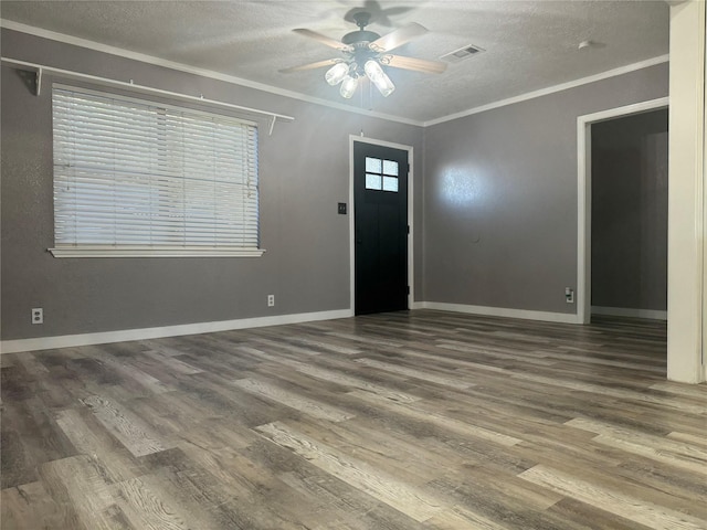 308 S 11th St, La Porte, TX 77571 - entryway featuring a textured ceiling, a ceiling fan, wood finished floors, and crown molding