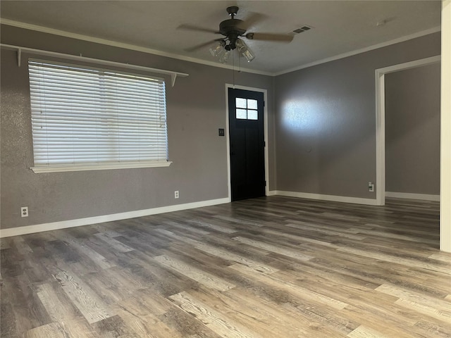 308 S 11th St, La Porte, TX 77571 - foyer entrance featuring ceiling fan, wood finished floors, and ornamental molding