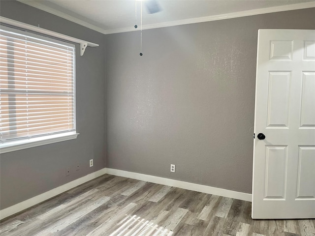 308 S 11th St, La Porte, TX 77571 - spare room with wood finished floors, crown molding, and a ceiling fan