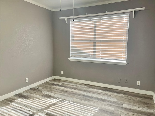 308 S 11th St, La Porte, TX 77571 - spare room featuring ornamental molding, wood finished floors, and plenty of natural light