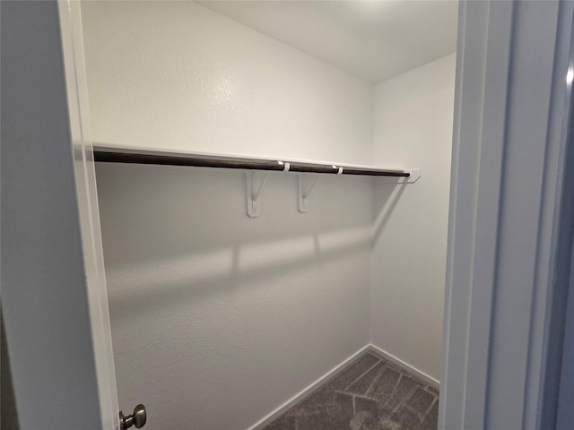 314 Nicholas Rd, Wharton, TX 77488 - spacious closet featuring dark carpet