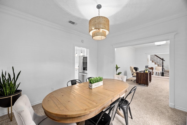 16235 Salmon Ln, Spring, TX 77379 - dining area with light carpet, a chandelier, crown molding, and stairway