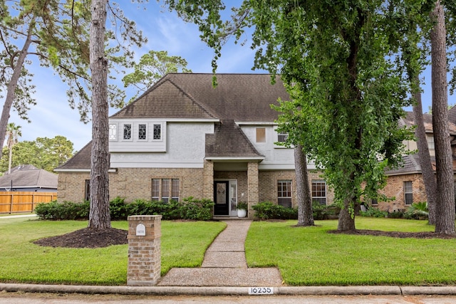 16235 Salmon Ln, Spring, TX 77379 - view of front of house featuring stucco siding, brick siding, and roof with shingles