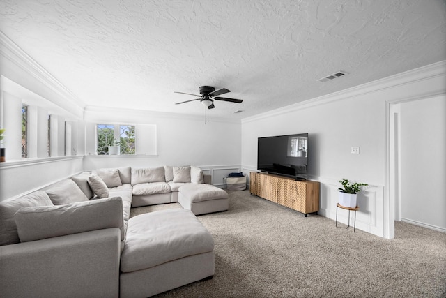 16235 Salmon Ln, Spring, TX 77379 - carpeted living area featuring crown molding, a ceiling fan, a textured ceiling, and wainscoting