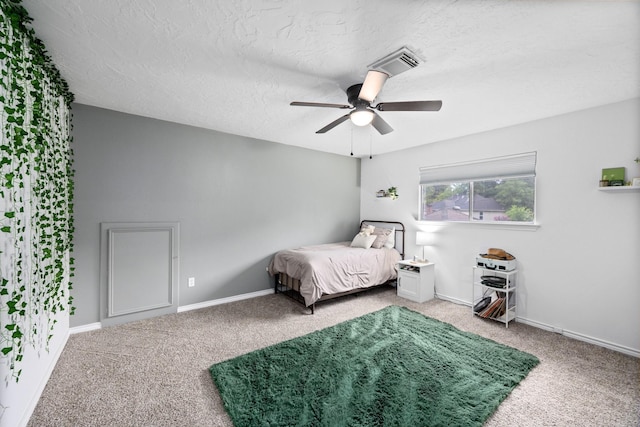 16235 Salmon Ln, Spring, TX 77379 - bedroom with carpet floors, a ceiling fan, and a textured ceiling