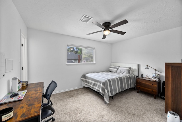 16235 Salmon Ln, Spring, TX 77379 - bedroom with an office area, light carpet, a ceiling fan, and a textured ceiling
