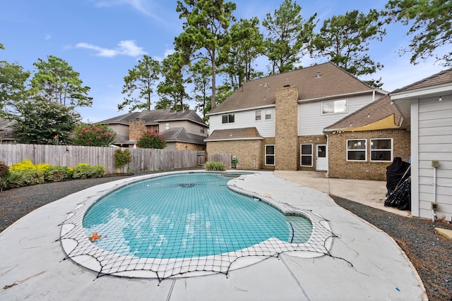 16235 Salmon Ln, Spring, TX 77379 - view of pool featuring a patio, a fenced backyard, and a pool with connected hot tub