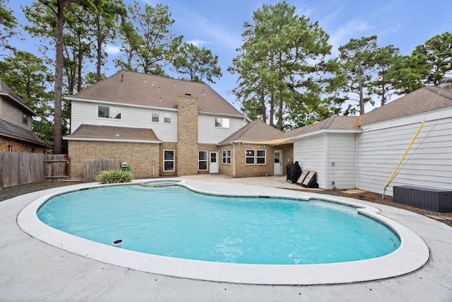 16235 Salmon Ln, Spring, TX 77379 - view of swimming pool featuring a pool with connected hot tub and a patio