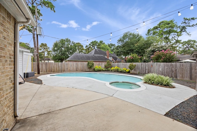 16235 Salmon Ln, Spring, TX 77379 - view of pool with a fenced backyard, a pool with connected hot tub, and a patio area