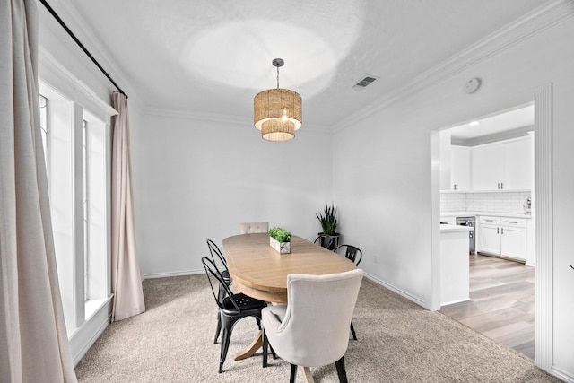 16235 Salmon Ln, Spring, TX 77379 - dining room featuring ornamental molding and light carpet
