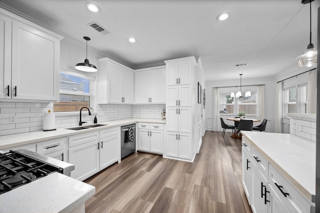 16235 Salmon Ln, Spring, TX 77379 - kitchen with dishwasher, white cabinetry, light countertops, recessed lighting, and light wood-type flooring