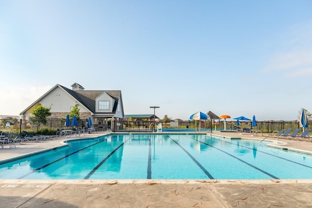 9458 Grand Spark Dr, Rosharon, TX 77583 - community pool with a patio area