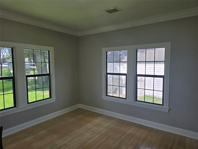 604 N Main St, Galena Park, TX 77547 - empty room with wood finished floors and crown molding
