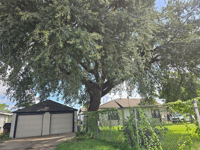 604 N Main St, Galena Park, TX 77547 - view of property exterior with a detached garage and an outbuilding