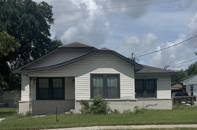 604 N Main St, Galena Park, TX 77547 - view of side of home with brick siding and a shingled roof