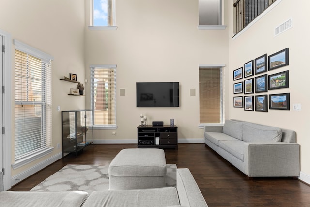2623 Shady Woods Ln, Houston, TX 77008 - living area featuring a towering ceiling, wood finished floors, and healthy amount of natural light