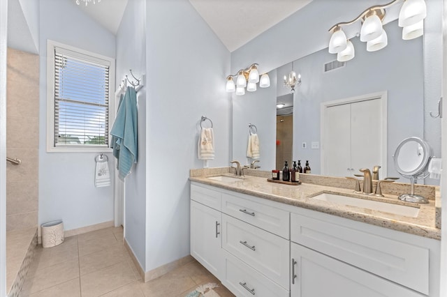 2816 Lighthouse Dr, Houston, TX 77058 - bathroom featuring double vanity, tile patterned flooring, vaulted ceiling, and a tile shower
