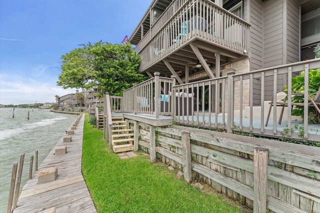 2816 Lighthouse Dr, Houston, TX 77058 - view of home's exterior with a balcony, ceiling fan, stairs, and a deck with water view