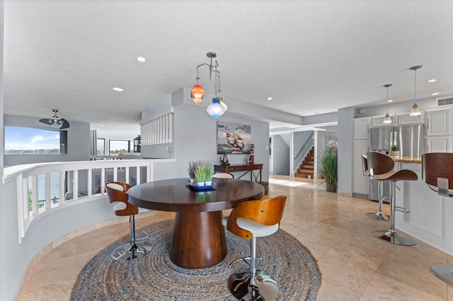 2816 Lighthouse Dr, Houston, TX 77058 - dining area with stairway, recessed lighting, and a textured ceiling