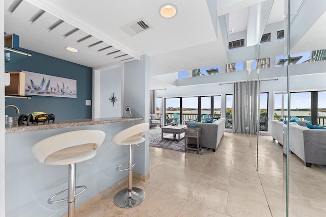 2816 Lighthouse Dr, Houston, TX 77058 - bar featuring a towering ceiling