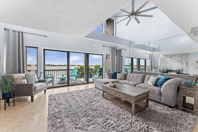 2816 Lighthouse Dr, Houston, TX 77058 - living room with a ceiling fan, a high ceiling, and tile patterned flooring