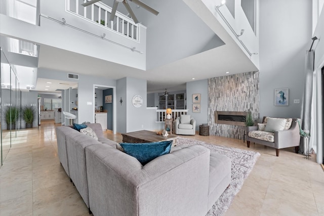 2816 Lighthouse Dr, Houston, TX 77058 - living room with a towering ceiling, a large fireplace, a ceiling fan, and light tile patterned floors