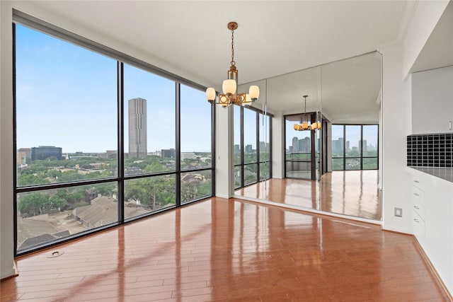 1111 Bering Dr Unit 1001, Houston, TX 77057 - unfurnished sunroom with a chandelier and a view of city