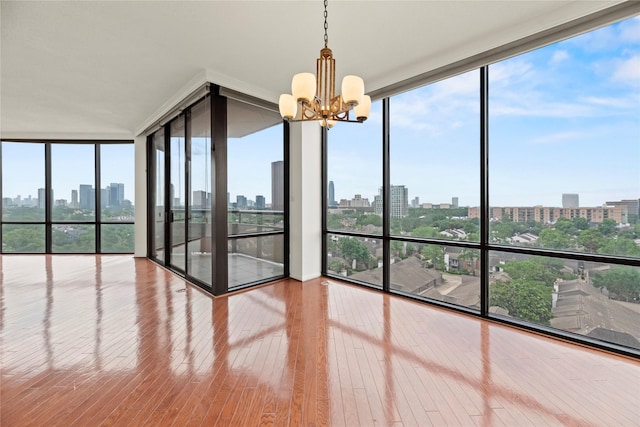 1111 Bering Dr Unit 1001, Houston, TX 77057 - unfurnished sunroom with a skyline view and a chandelier