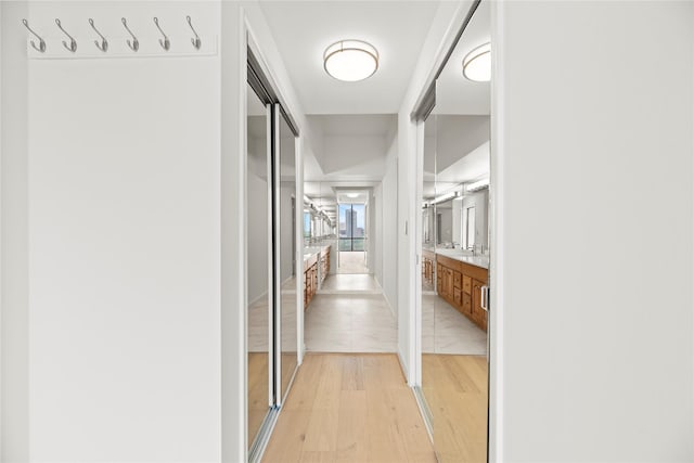 1111 Bering Dr Unit 1001, Houston, TX 77057 - hall featuring light wood-style floors and a sink