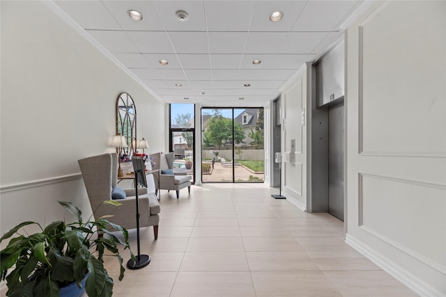 1111 Bering Dr Unit 1001, Houston, TX 77057 - hallway with floor to ceiling windows, recessed lighting, light tile patterned floors, and crown molding