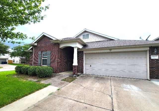 3301 Clover Hill Ln, Texas City, TX 77591 - ranch-style home with driveway, brick siding, and an attached garage