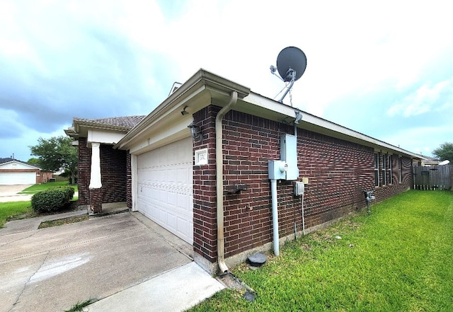 3301 Clover Hill Ln, Texas City, TX 77591 - view of property exterior with brick siding, concrete driveway, a yard, and a garage