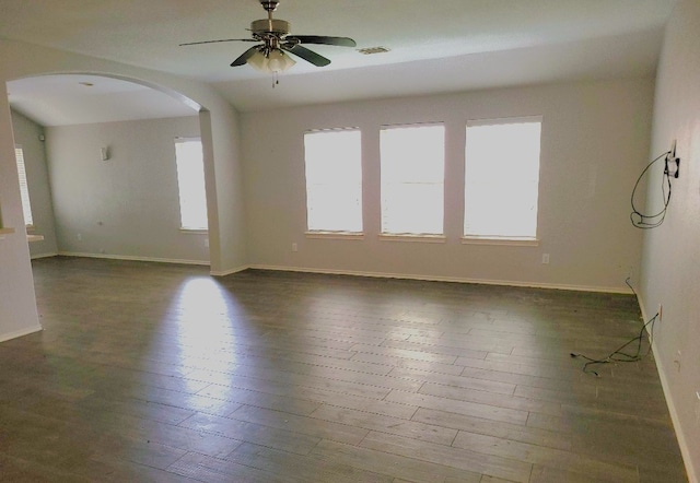 3301 Clover Hill Ln, Texas City, TX 77591 - spare room with arched walkways, hardwood / wood-style flooring, and a ceiling fan