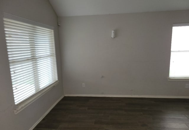 3301 Clover Hill Ln, Texas City, TX 77591 - empty room with dark wood finished floors and vaulted ceiling
