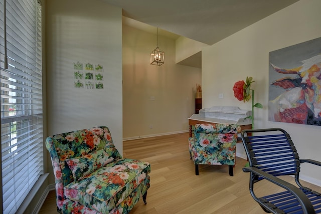 1009 Old Vine, Brenham, TX 77833 - sitting room with wood finished floors and a chandelier